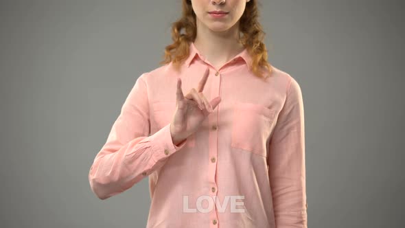 Female Signing Love in Asl, Text on Background, Nonverbal Communication for Deaf