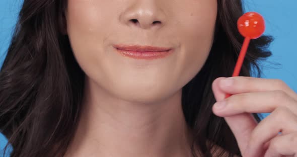 Woman tasting candy