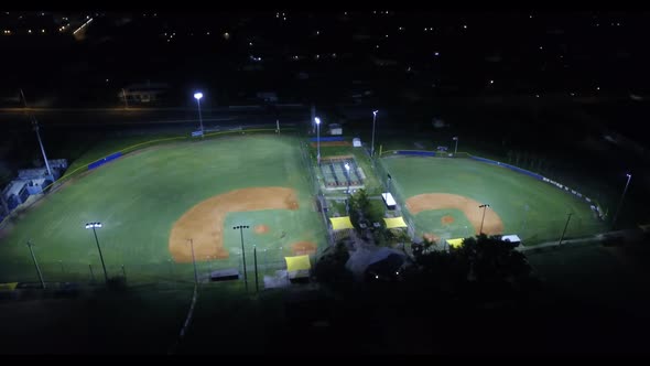 A night shot of a baseball park.