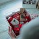The Girl Collects a Christmas Present in a Box - VideoHive Item for Sale