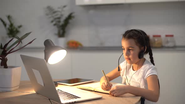 Little Girl Kid Studen Studying Online Class with Laptop at Home New Normal