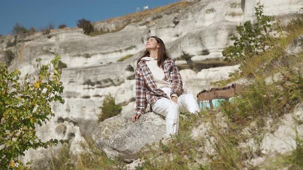 Pleasant Woman Relaxing on Stone Near Bakota Bay