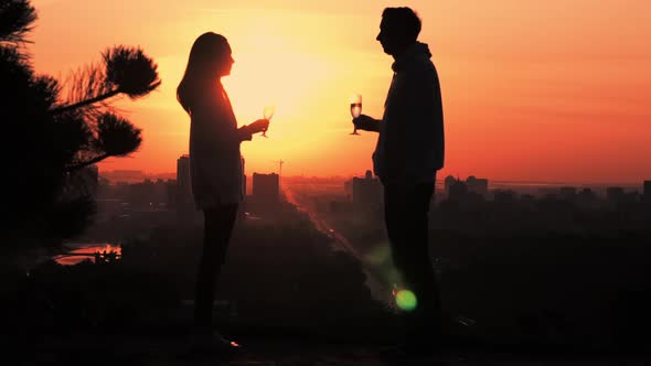 Couple Drinking Wine Outdoors