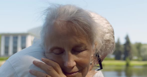 Close Up Shot of Senior Loving Couple Hugging in Park