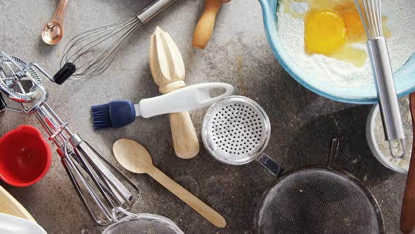 Gingerbread cookies ingredients with various utensils on table 4k