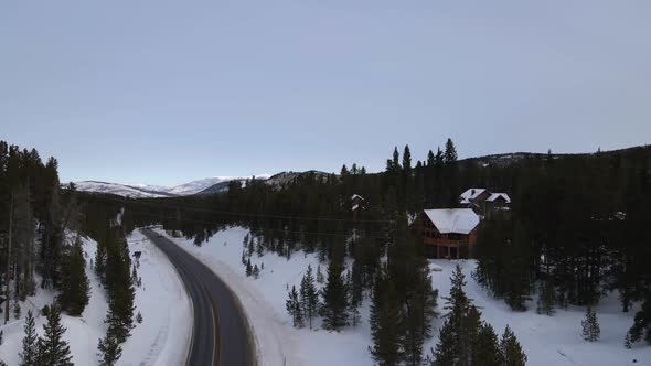 Winter Cabin on Lonely Highway in Snowy Mountains