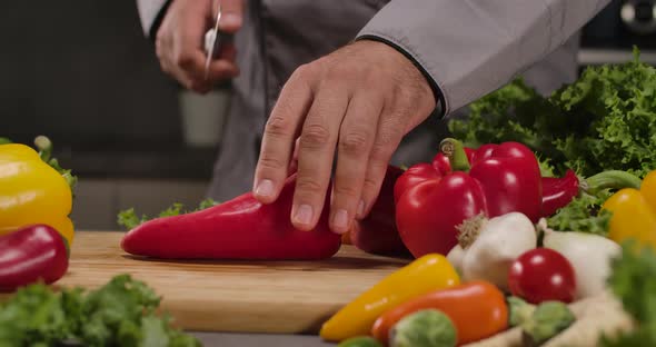 Cutting Fresh Red Paprika