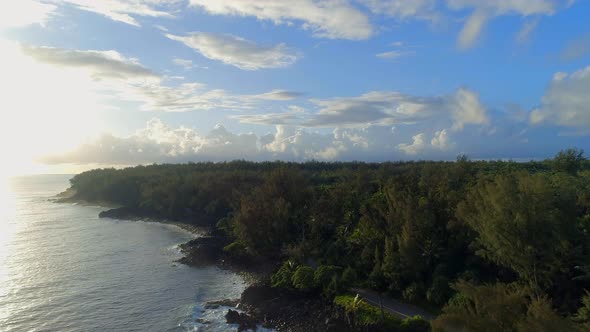 Sunrise Over a Rocky Coastline with the Hawaiian Jungle