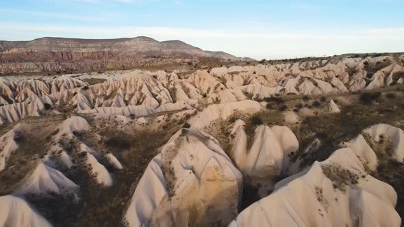 Cappadocia Aerial Drone or Balloon View to Red and Rose Valley Rock Formation Ancient Cave Churches