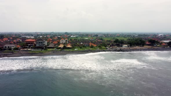 Black Sand Beach in Gray Foggy Day Aerial