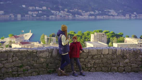 A Woman and Her Son Visit the Old Town of Kotor in Montenegro