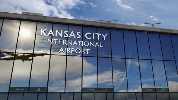 Airplane landing at Kansas City Missouri mirrored in terminal