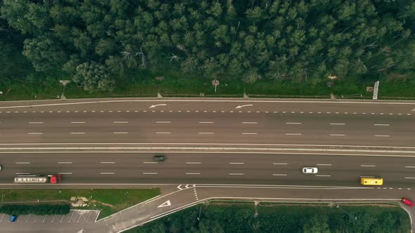 Traffic of Cars and Trucks on the Threeway Country Road in Summer Day  Overhead Shot