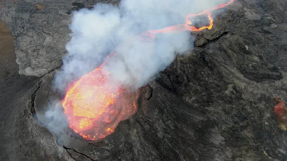 Aerial view of Fagradalsfjall volcano crater filled with lava, Iceland