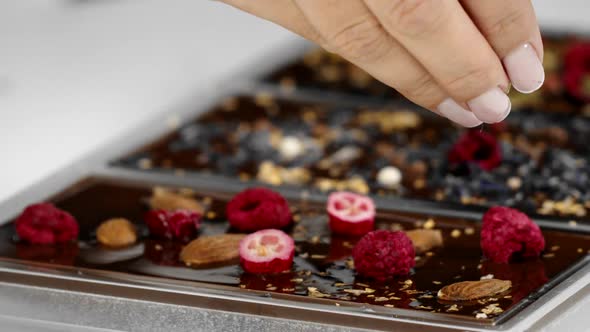 Manufacture of Exquisite Chocolate Bar. Chef Decorates Molten Chocolate Slow Mo