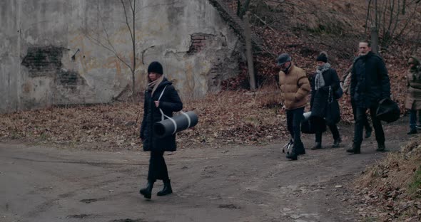 Depressed War Refugees Walking With Luggage