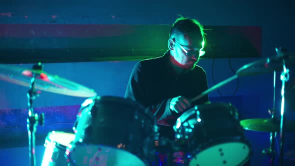 Drummer Playing Drums in the Nightclub