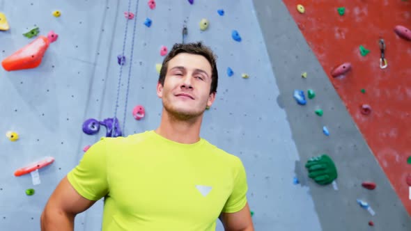 Confident man standing in fitness studio 4k