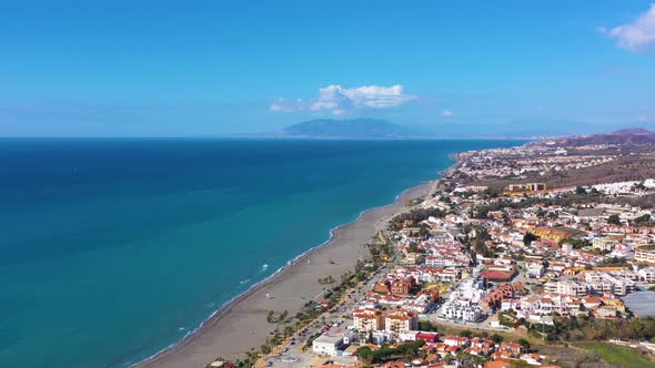 Fly over the village in the region of Malaga Andalusia Benajarafe Spain.