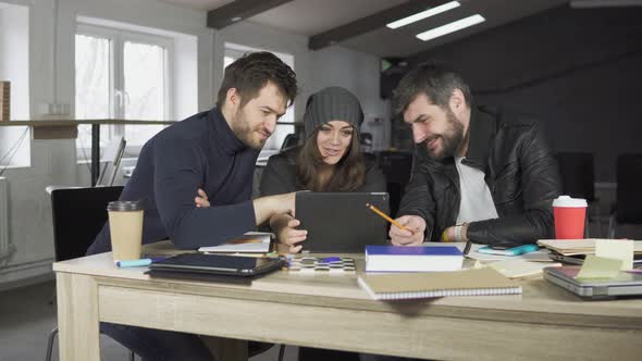 Team of Young Professionals Having a Meeting in a Creative Office