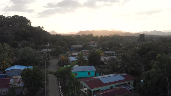 A drone shot over homes in a small Central American village.