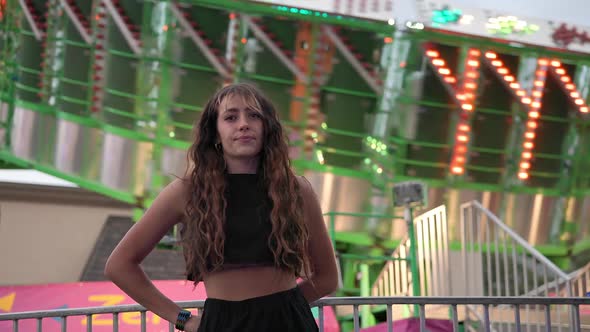 Young woman turns head and looks at camera