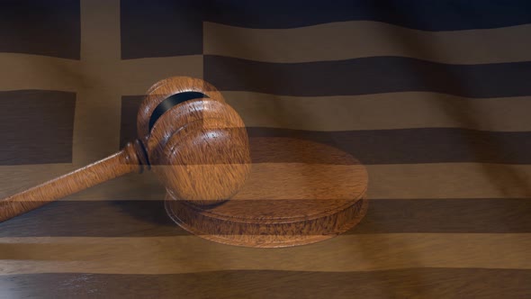 Greek judiciary. Flag of Greece and Judge's gavel.