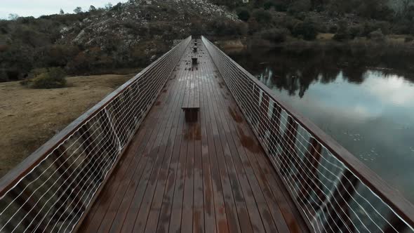 Aerial view of footbridge over pond