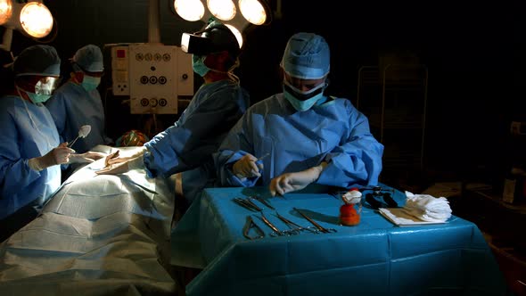 Surgeons performing operation in operation room