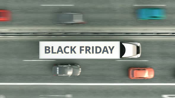 Trucks with BLACK FRIDAY Text Driving Along the Road