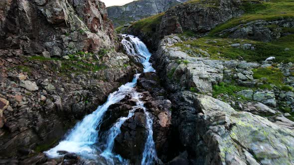 Powerful stream of a mountain river with clear water