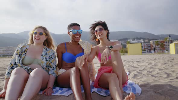 young women having fun on the beach