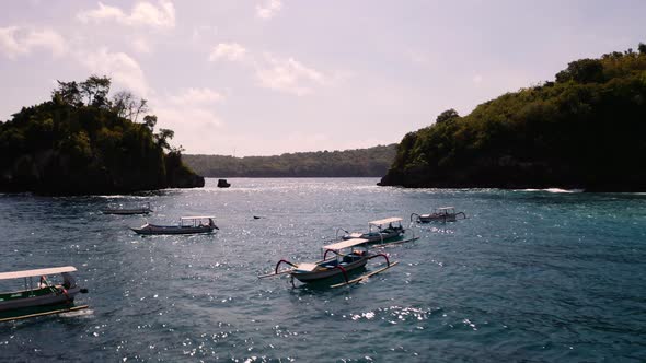 Traditional outrigger canoes anchored at Crystal Bay, Nusa Penida; aerial