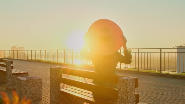 Portrait of Woman Pretty Caucasian Woman with Long Hair Smiling in the City at Sunrise