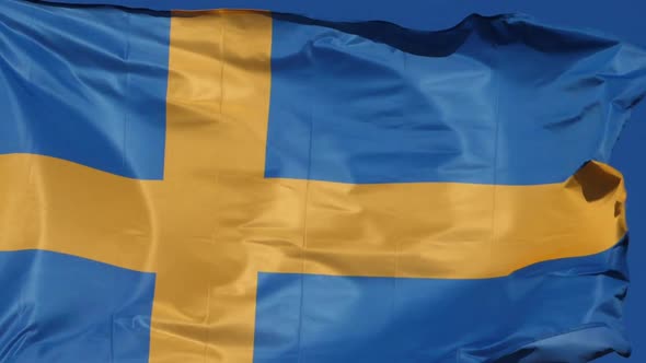 The national swedish flag waving in the wind.