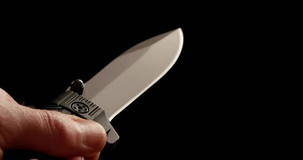 4K - Folding knife in hand. Close-up