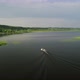Aerial View of a Fishing Boat Moving Along River - VideoHive Item for Sale