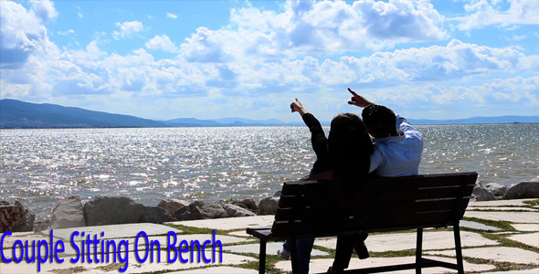 Couple Sitting On Bench