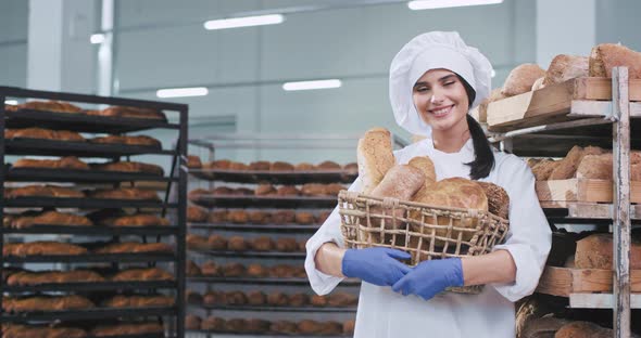 Bakery Industry Young Woman Baker with a Basket of