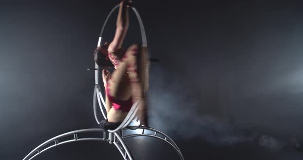 Gorgeous Gymnastics Performance in a Steel Hoop By a Young Athletic Woman