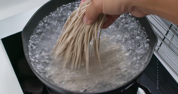 Cook with japanese soba in the kitchen