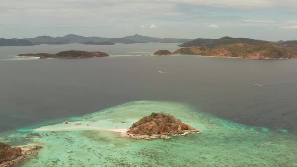 Small Torpic Island with a White Sandy Beach Top View