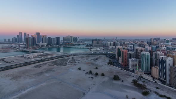 Aerial Skyline of Abu Dhabi City Centre From Above Day to Night Timelapse