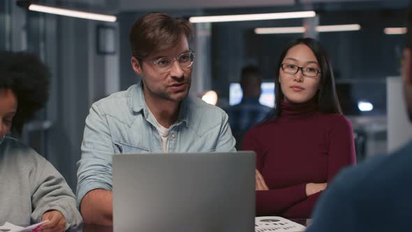 Close Up of Diverse Entrepreneurs Consulting Client in Modern Office