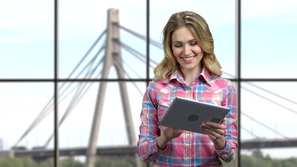 Young Woman Speaker Using Digital Tablet.