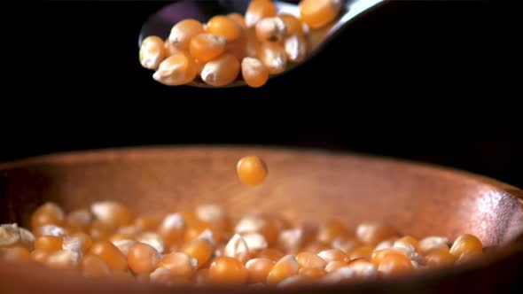 Super Slow Motion Popcorn Grains Fall From Spoon to Plate