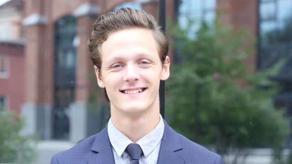 Portrait of Smiling Young Businessman