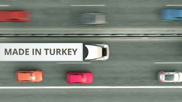 Trailer Trucks with MADE IN TURKEY Text Driving Along the Highway