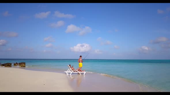 Man and lady suntan on paradise sea view beach holiday by blue ocean and bright sandy background of 