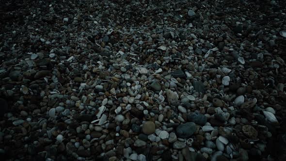 Moving Over Beach Pebbles At Night